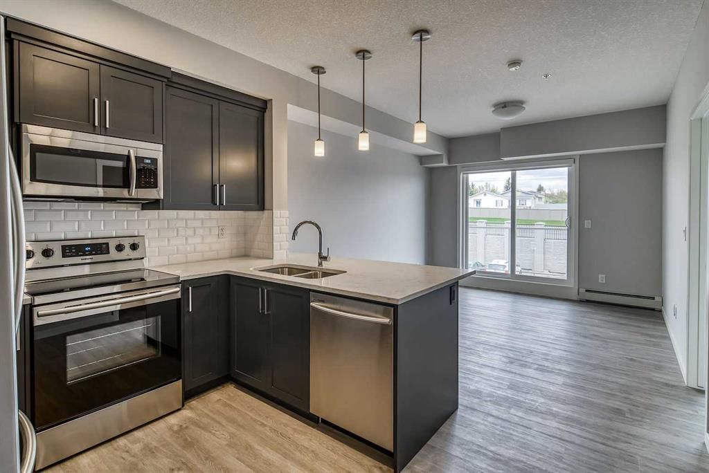 215, 300 Harvest Hills Place NE, Calgary — main listing photo