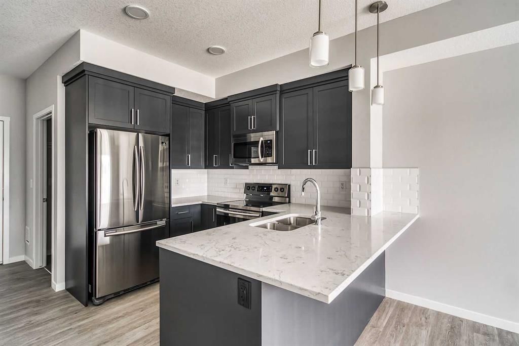 215, 300 Harvest Hills Place NE, Calgary — photo 3 of 17