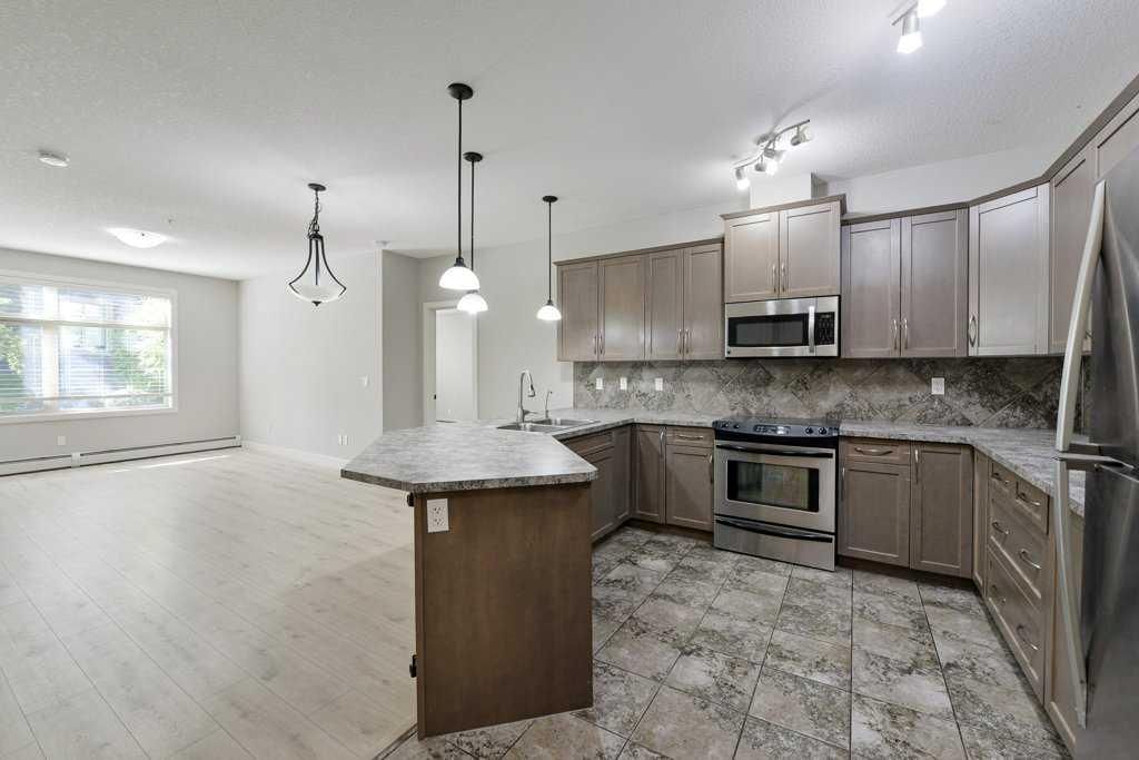 235, 35 ASPENMONT Heights SW, Calgary — photo 4 of 49