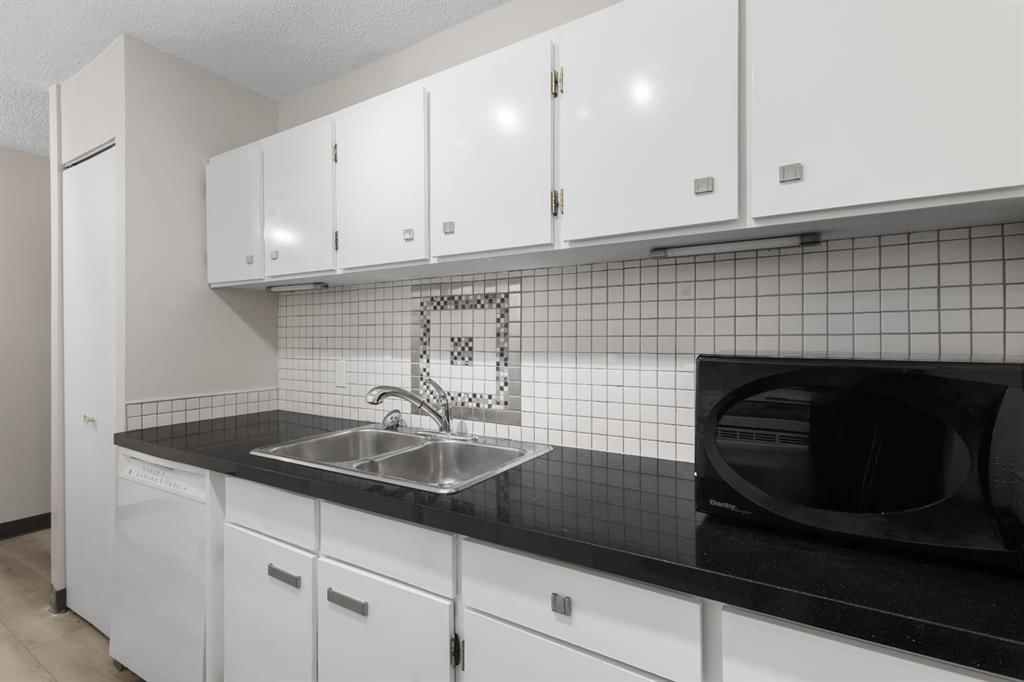704, 4944 Dalton Drive NW, Calgary — photo 5 of 24