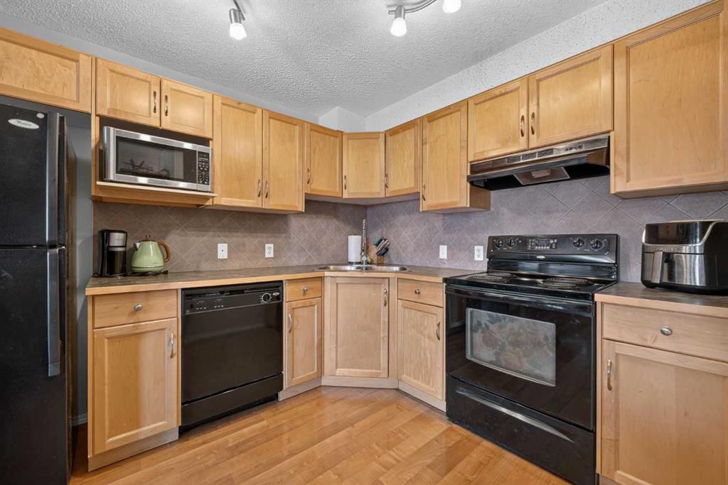 2207, 140 Sagewood Boulevard SW, Airdrie — photo 5 of 23