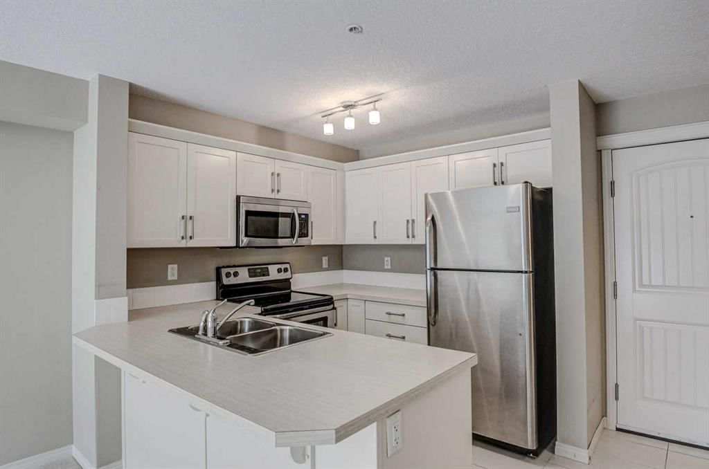 2217, 130 Panatella Street NW, Calgary — photo 3 of 23