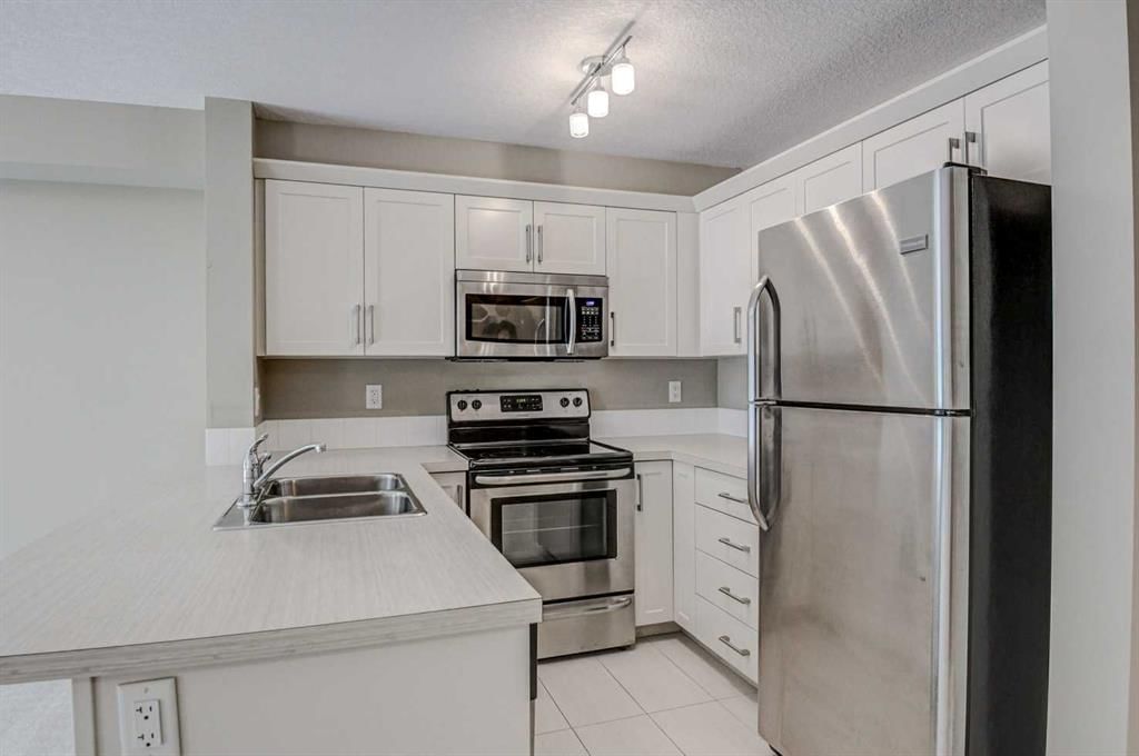 2217, 130 Panatella Street NW, Calgary — photo 4 of 23