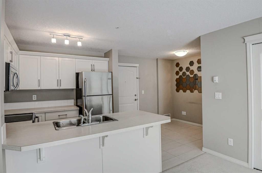 2217, 130 Panatella Street NW, Calgary — photo 5 of 23